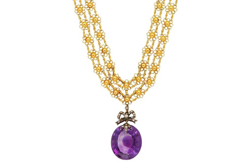 A fancy-link necklace with an amethyst pendant The oval-cut...