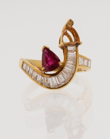 18KT GOLD, DIAMOND AND RUBY BYPASS RING Set with a pear-cut ruby, approx. 6.6mm x 5.2mm x 2.0mm, and 16 step-cut diamonds. Size 7¼.