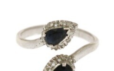 1927/1168 - A sapphire and diamond ring set with two pear-shaped sapphires encircled by numerous single-cut diamonds, mounted in sterling silver. Size 57.