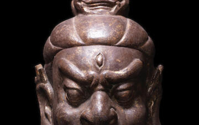A large iron head of Dvarapala