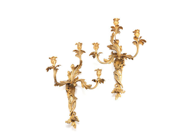 A pair of large French gilt bronze three light wall appliques