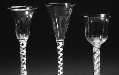 Two mixed-twist stem wine glasses and an opaque-twist flute, circa 1760