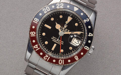 Rolex. A rare stainless steel automatic calendar bracelet watch with dual time zone and bakelite bezel