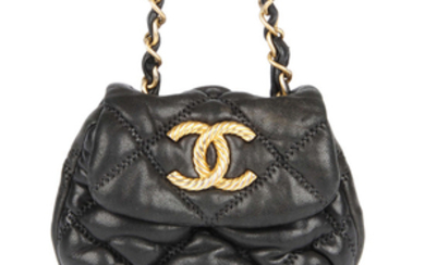 CHANEL - a mini quilted purse.