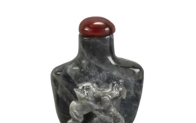 CHINESE BLACK OPAL SNUFF BOTTLE With high relief monkey carving. Height 1.5". Carnelian stopper.