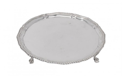 A silver shaped circular salver by Harrods Stores Ltd