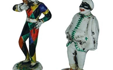 Two small statues Two male masks in multicoloured dresses in...