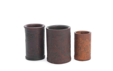A group of three bamboo brushpots