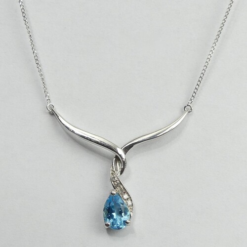 9 carat white gold blue topaz and diamond necklace, 2.2 gram...