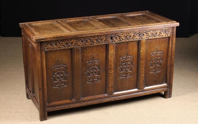 A 17th Century Oak Four Panel Joined Oak Coffer (A/F). The lid having a channel moulded frame on rep