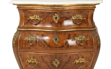A 19/20th century bombé shaped partly gilt Rococo style walnut chest of...