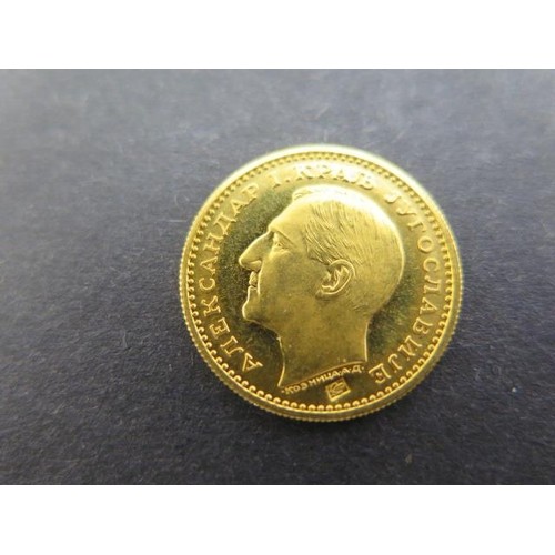 A 1932 gold Yugolavian 1 Dukat coin, portrait of Alexander I...