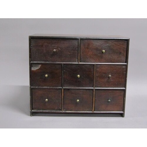 A 19c mahogany double sided table top cabinet fitted eight d...