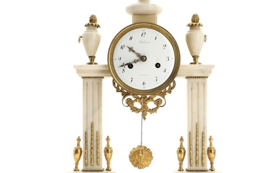 A 19th century French Louis XVI style white alabaster and brass portico clock. H. 46 cm.