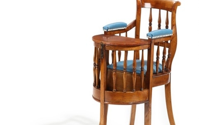 A 19th century polished beech and fruit wood children's chair with removeable table top.