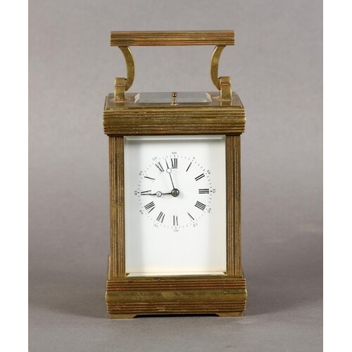 A BRASS CASED REPEATING CARRIAGE CLOCK with angular swing ha...