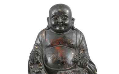 A BRONZE FIGURE OF A SEATED BUDAI WITH...