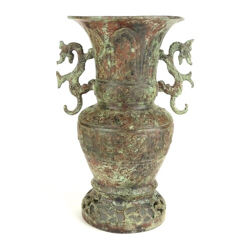 A CHINESE ARCHAIC FORM VASE Twin dragon handles with embosse...