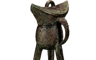 A CHINESE BRONZE JUE CUP WITH COVER