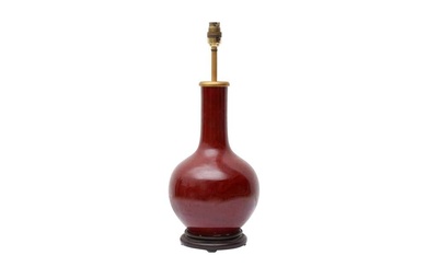 A CHINESE MONOCHROME COPPER RED-GLAZED VASE 清十九世紀 紅釉瓶