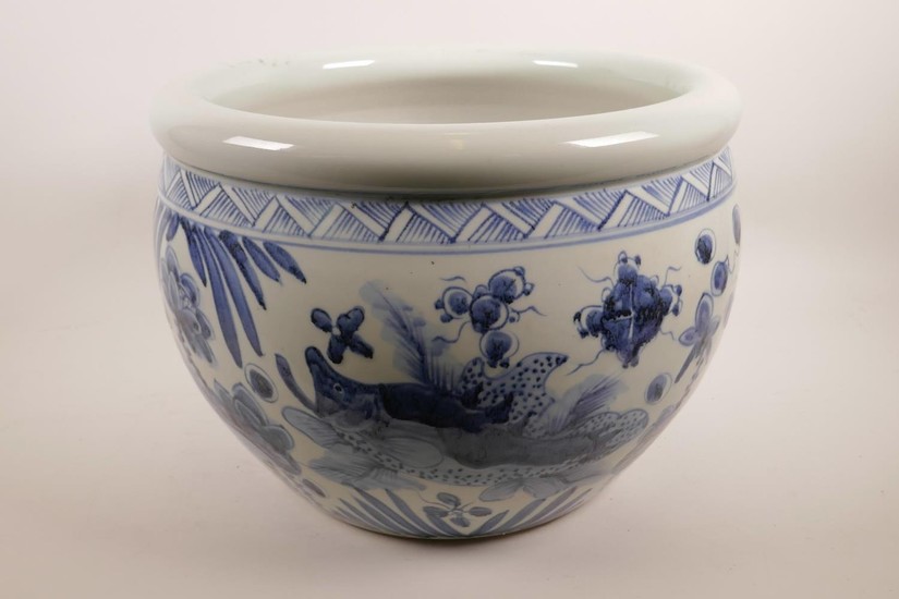 A Chinese blue and white pottery jardiniere decorated with c...