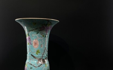 A Chinese enamelled famille rose trumpet shape vase with...