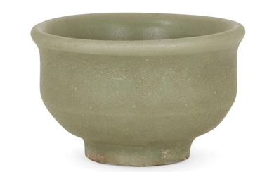 A Chinese grey stoneware celadon wine cup, Yuan-Ming dynasty, with straight sides and everted rim, 8cm diameter