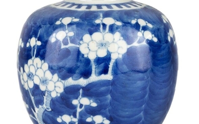 A Chinese miniature blue and white 'prunus' jar, 19th century, painted with blossoming prunus branches on a deep blue ground, underglaze blue double ring mark to base, 12cm high 十九世紀 青花冰梅紋小罐