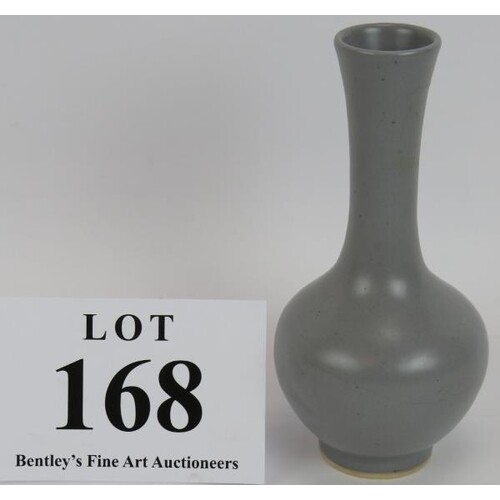 A Chinese porcelain bottle vase in grey glaze with six chara...