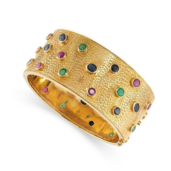 A GEM SET BANGLE the hinged cuff of textured design