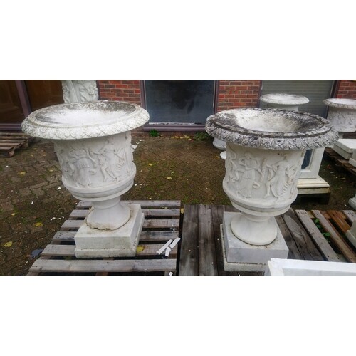 A GOOD PAIR OF ITALIAN CARVED WHITE MARBLE URNS , the sides ...
