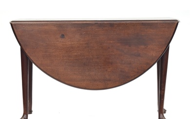A George II mahogany oval drop leaf table on tapering turned...