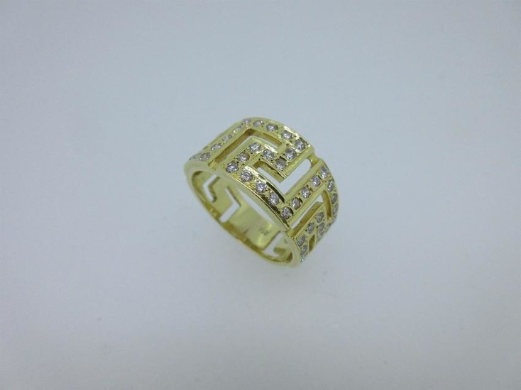 A Greek key pattern band ring set with diamonds