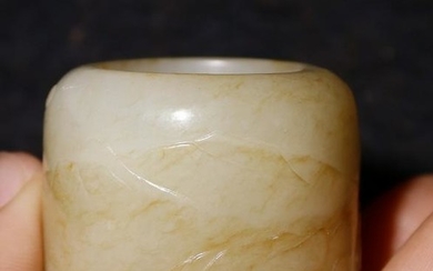 A HETIAN JADE RING WITH FIGURE STORY PATTERN