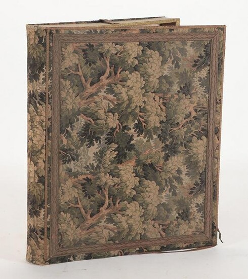 A LARGE VINTAGE FABRIC COVERED FOLIO