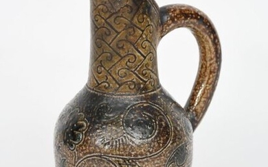 A Martin Brothers stoneware jug by Robert Wallace Martin, ovoid body with pulled vertical neck and spout, incised with scrolling foliage band, the neck with geometric pattern, glazed olive green and brown, incised 30.12.80 (?) R W Martin London &...