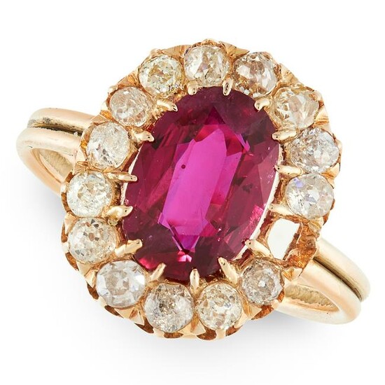 A RUBY AND DIAMOND CLUSTER RING in yellow gold, set