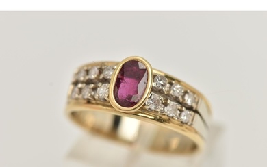 A RUBY AND DIAMOND RING, designed as an oval cut ruby in a c...