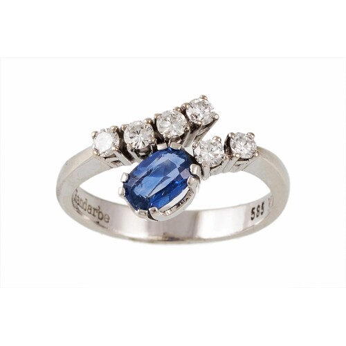 A SAPPHIRE AND DIAMOND DRESS RING, the oval cut sapphire and...