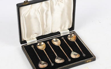 A SET OF STERLING SILVER ACANTHUS KNOB SPOONS.