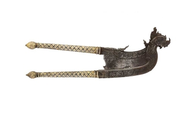 A SINGHA-SHAPED GILT NIELLOWARE STEEL BETEL NUT CUTTER Thailand, South East Asia, 19th century