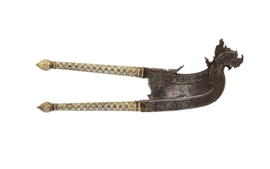 A SINGHA-SHAPED GILT NIELLOWARE STEEL BETEL NUT CUTTER Thailand, South East Asia, 19th century