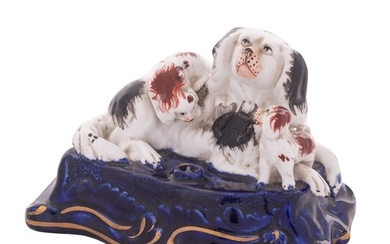 A Staffordshire porcelain 'spaniel family' inkwell in the fo...