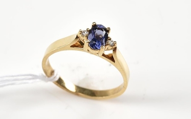 A TANZANITE AND DIAMOND RING IN 9CT GOLD
