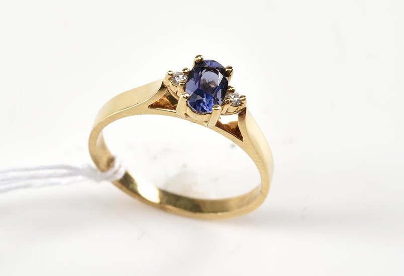 A TANZANITE AND DIAMOND RING IN 9CT GOLD