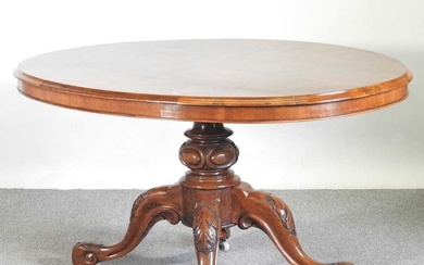 A Victorian burr walnut breakfast table, with a hinged oval...