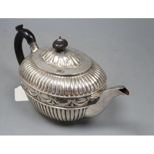 A Victorian fluted silver oval teapot by William Hunter, Lon...