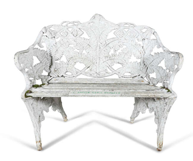 A WHITE PAINTED CAST IRON GARDEN SEAT, of...