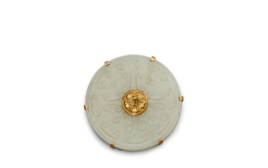 A carved jade bi disc in a gilt metal mount
