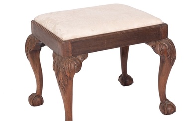 A carved mahogany and upholstered dressing table stool in la...